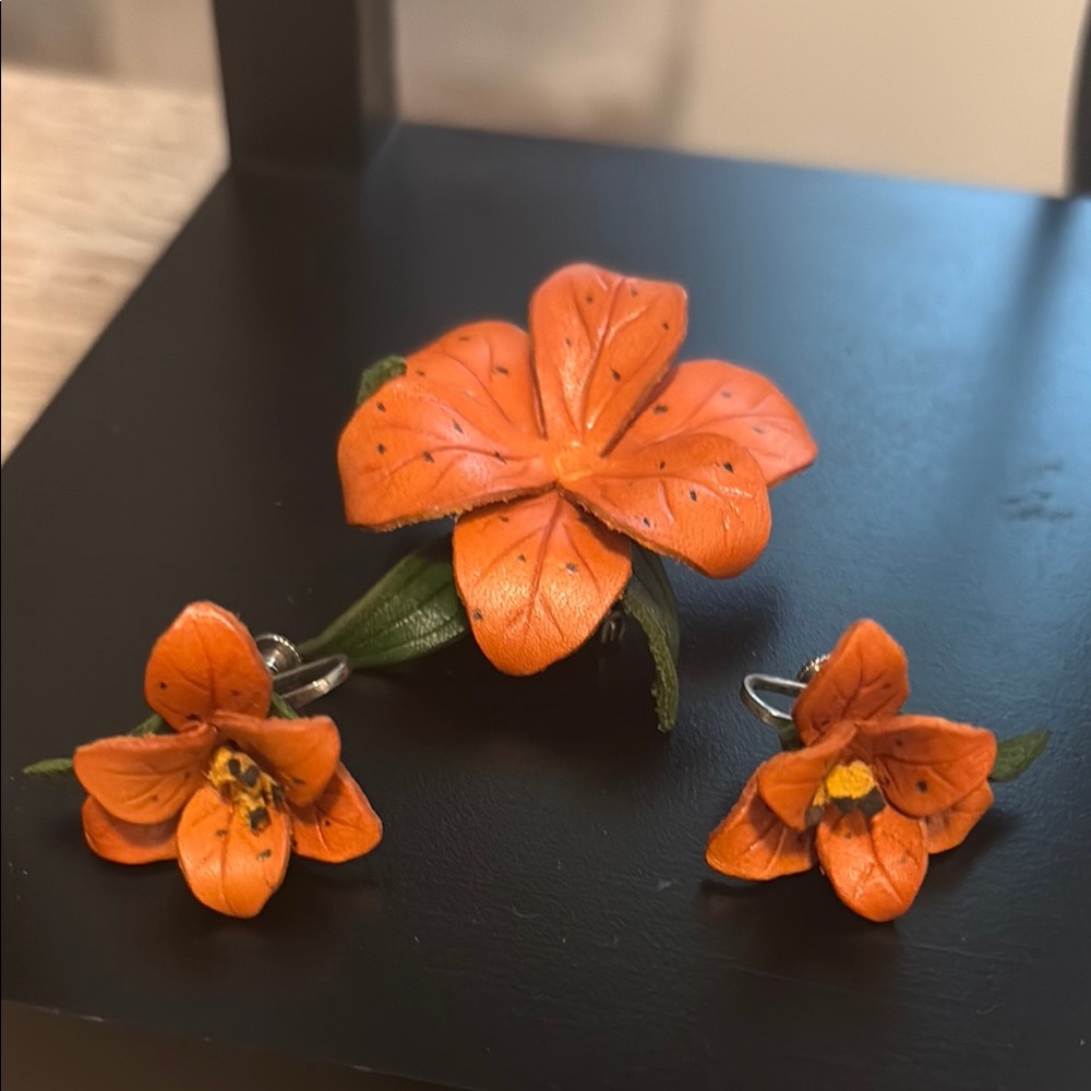 1991 signed leather floral brooch with screwback earrings